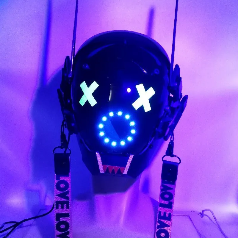 Black futuristic helmet with X-shaped eyes, LED ring mouth and printed straps